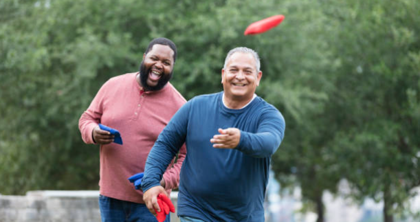 Men Playing Cornhole Outdoors