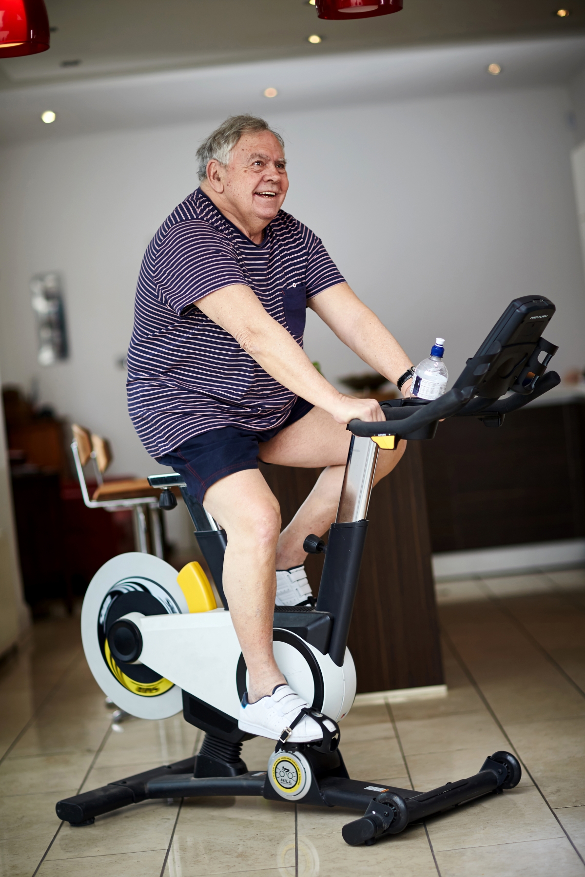 man on exercise bike man on exercise bike