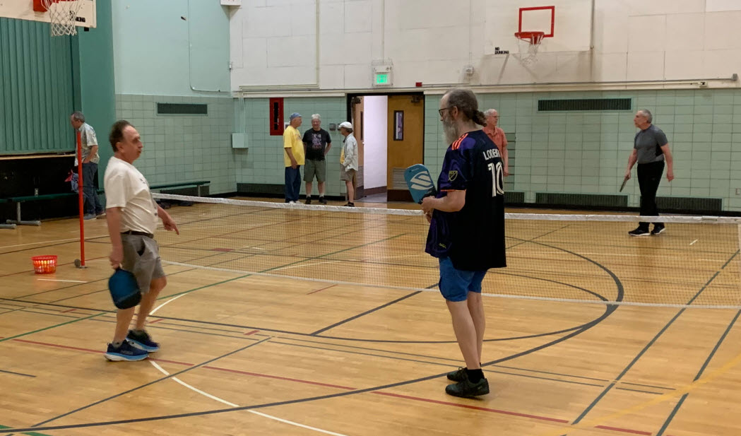 men playing pickleball